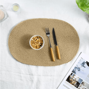 Place cups and cutlery on an oval jute placemat